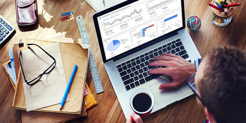 Overhead view of a man using Google Data Studio to make interactive charts